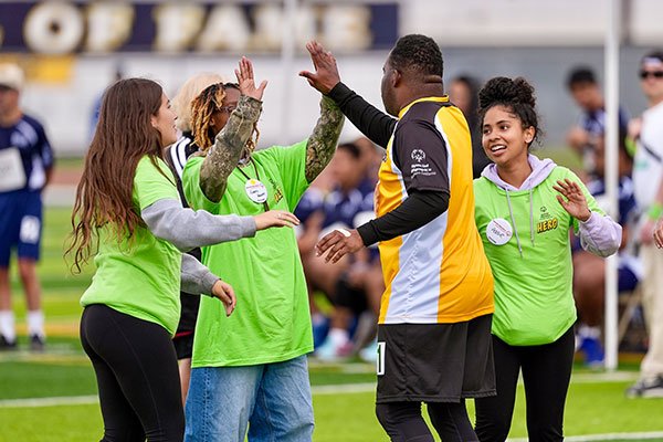 Volunteers cheering on Special Olympic athletes at 2025 LA Spring Competition